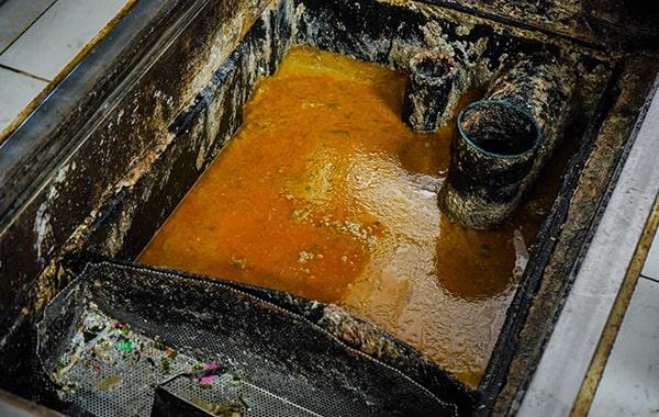 proper grease trap cleaning helps prevent grease and oil from entering the drain system and contaminating waterways